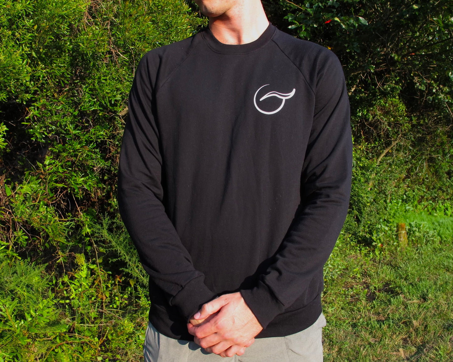 Breath black crewneck sweater, crafted from 100% organic cotton. Soft, sustainable, and ethically made in the USA for a timeless look.