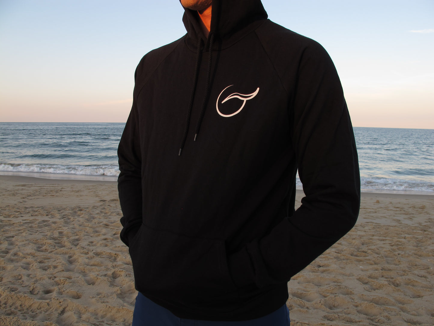 Black hoodie by Breath, made in the USA with eco-friendly organic cotton. Soft, comfortable, and perfect for everyday wear.