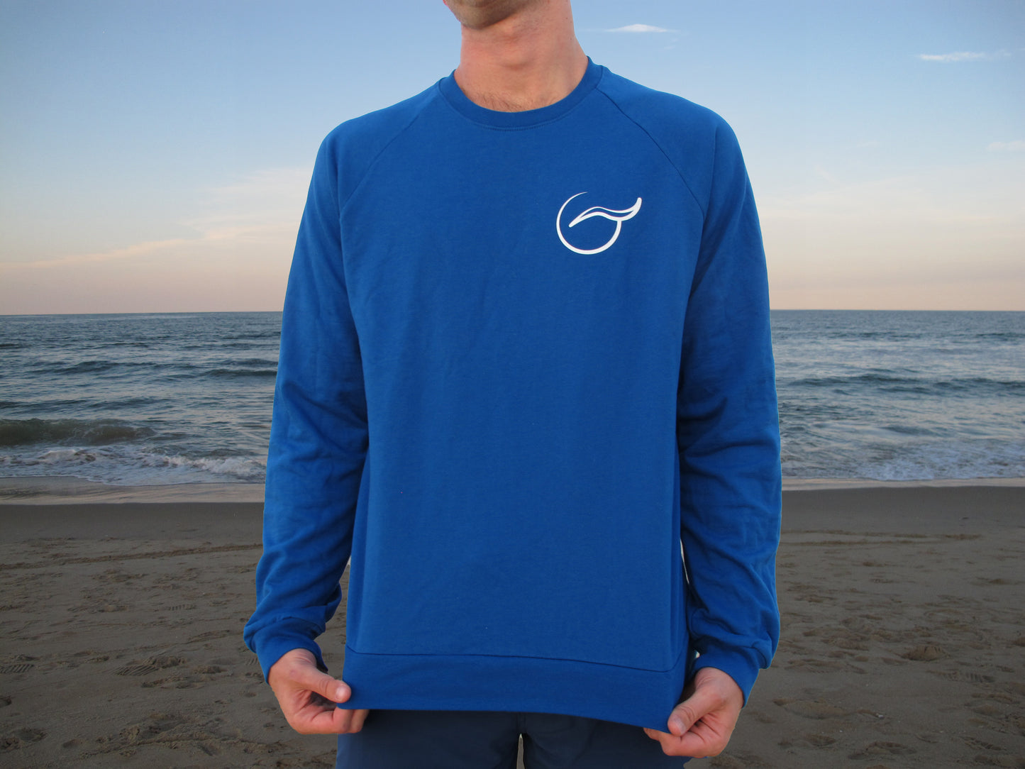 Cozy up in Breath's blue crewneck sweater, made from 100% organic cotton. Designed for a sustainable lifestyle, this USA-made piece combines classic comfort with eco-friendly style.