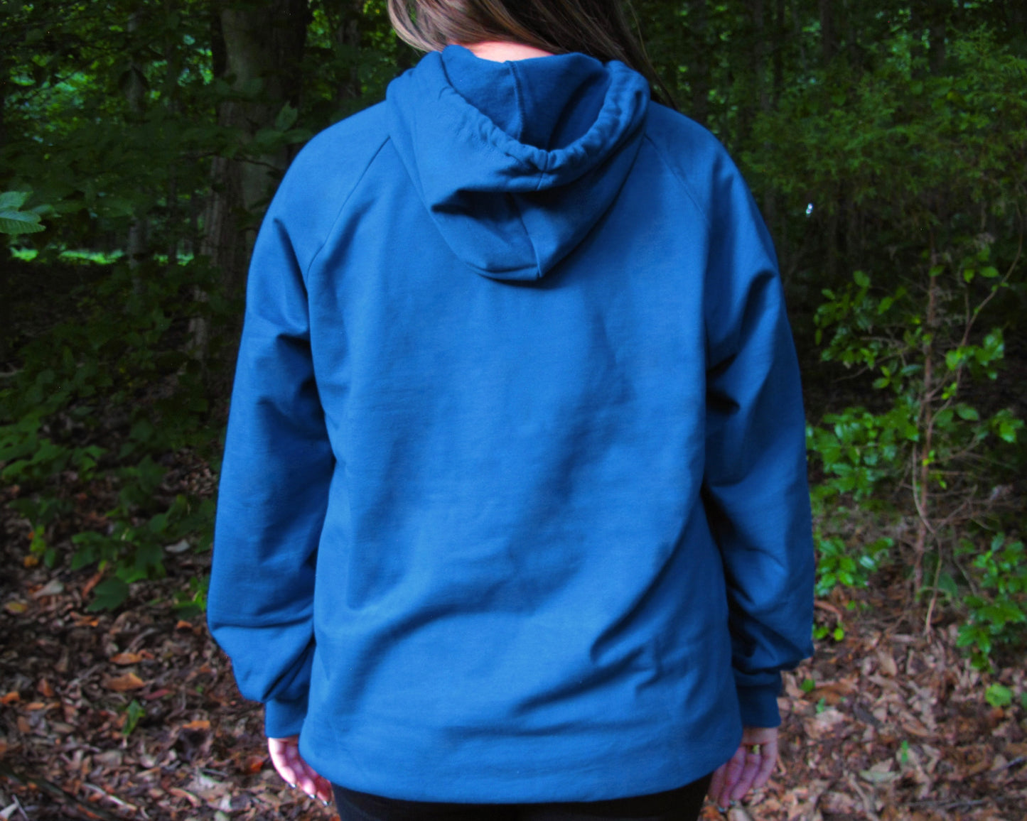 Unisex blue hoodie by Breath, made in the USA from 100% organic cotton. Soft, sustainable, and designed for all-day comfort.