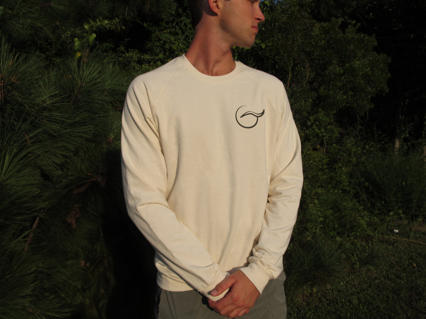 Breath tan crewneck sweater, perfect for layering. Made with 100% organic cotton, this ethically crafted, USA-made piece combines comfort and sustainability.