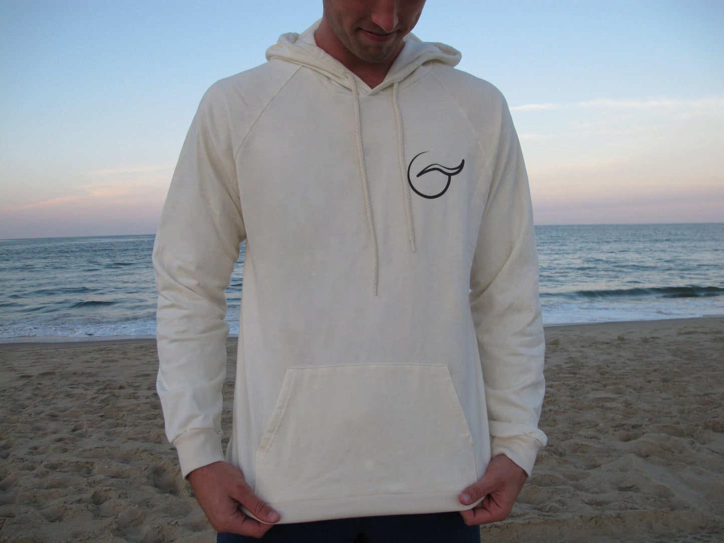 Breath unisex tan hoodie, made in the USA from 100% organic cotton. Soft, sustainable, and ethically crafted for all-day comfort.