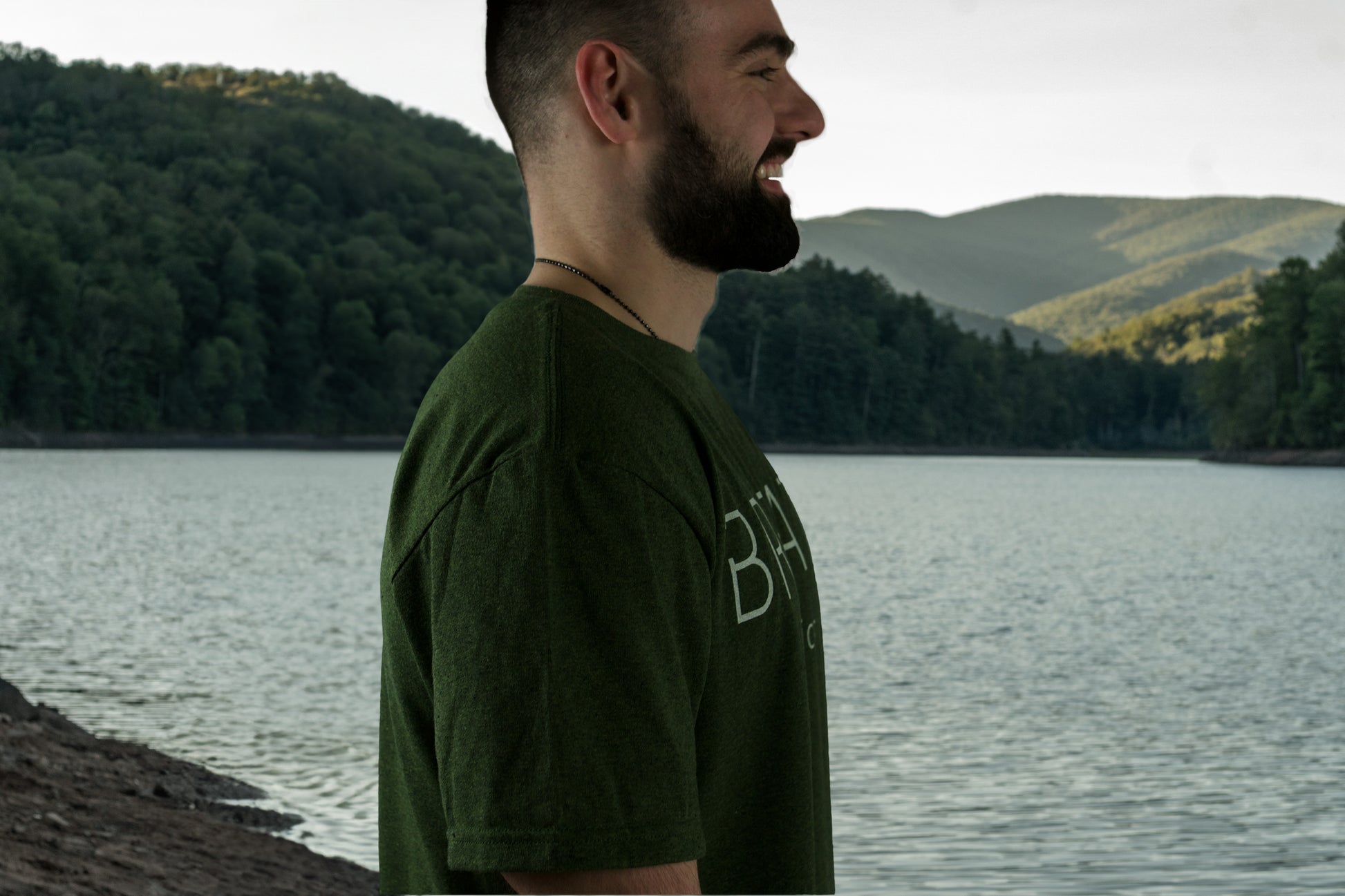 Green Breath Short Sleeve 50 50 Up-cycled cotton and Recycled Polyester T shirt with Breath across the Chest and The Logo in between the shoulders.