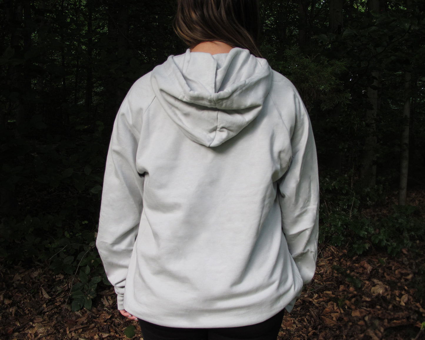 Unisex grey hoodie by Breath, crafted from 100% organic cotton. Ethically made in the USA for a soft, sustainable, and stylish fit.